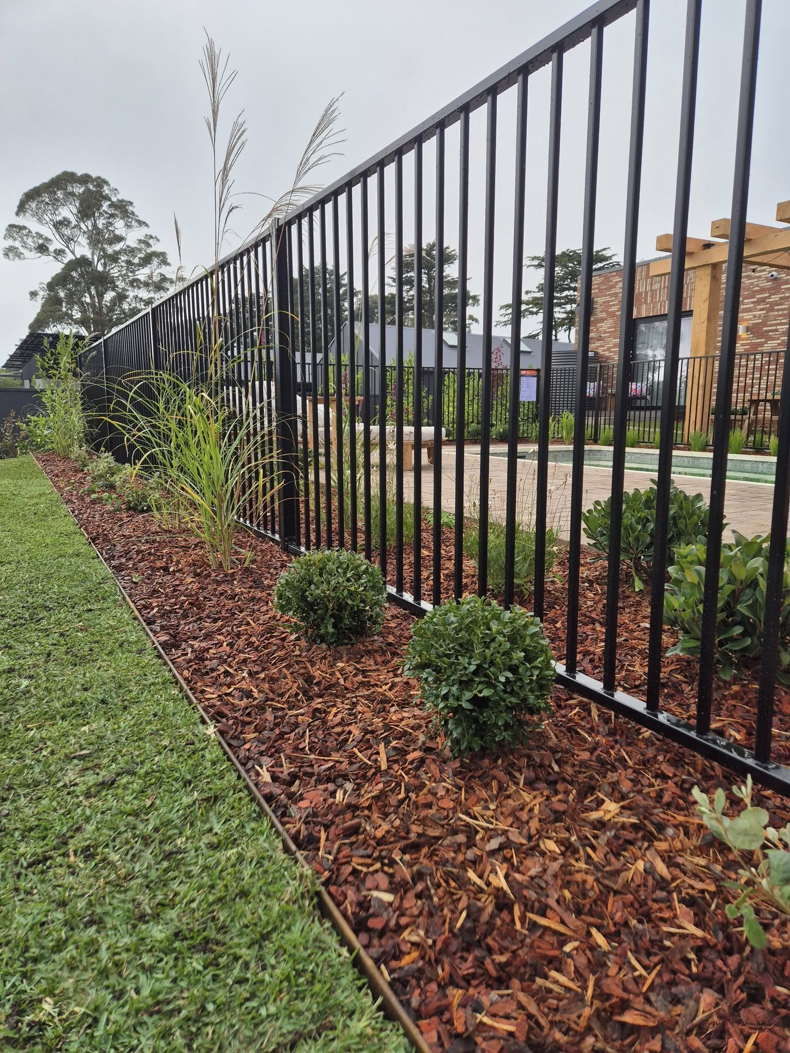 Timber batten privacy screen with matching pedestrian gate
