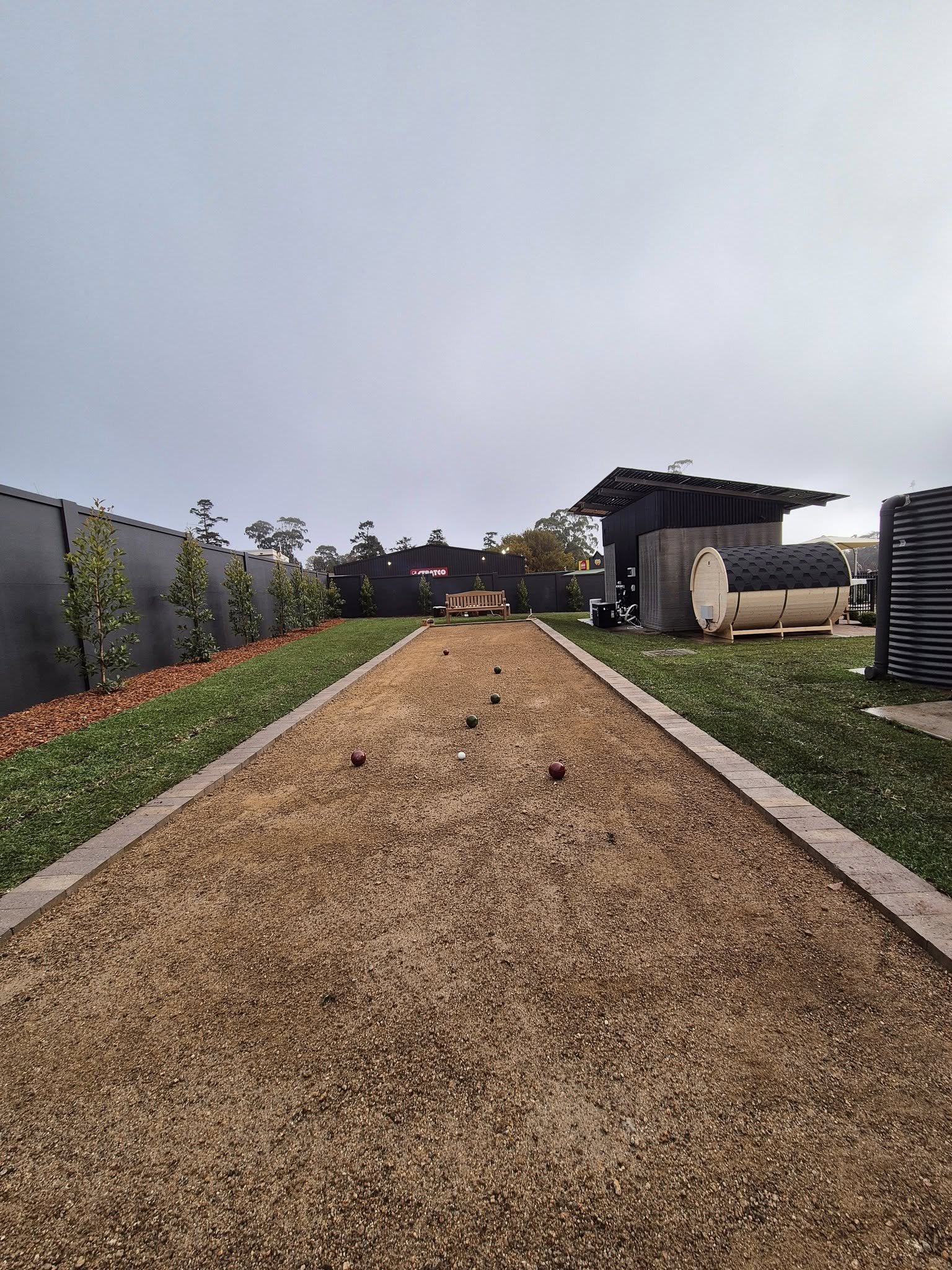 Landscape construction site prepared with compacted base and set-out pegs