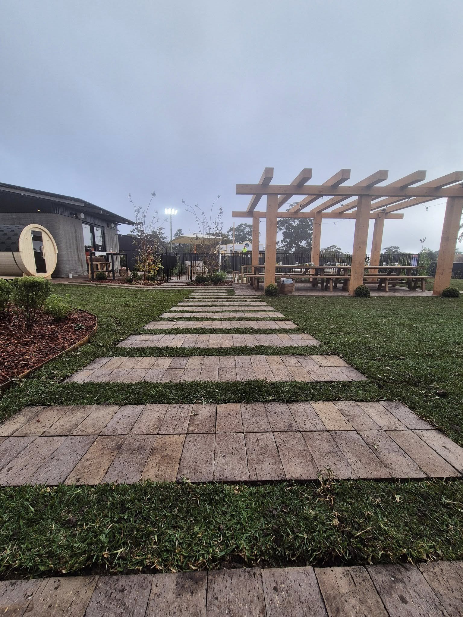 Freshly installed premium turf lawn with a crisp concrete edge